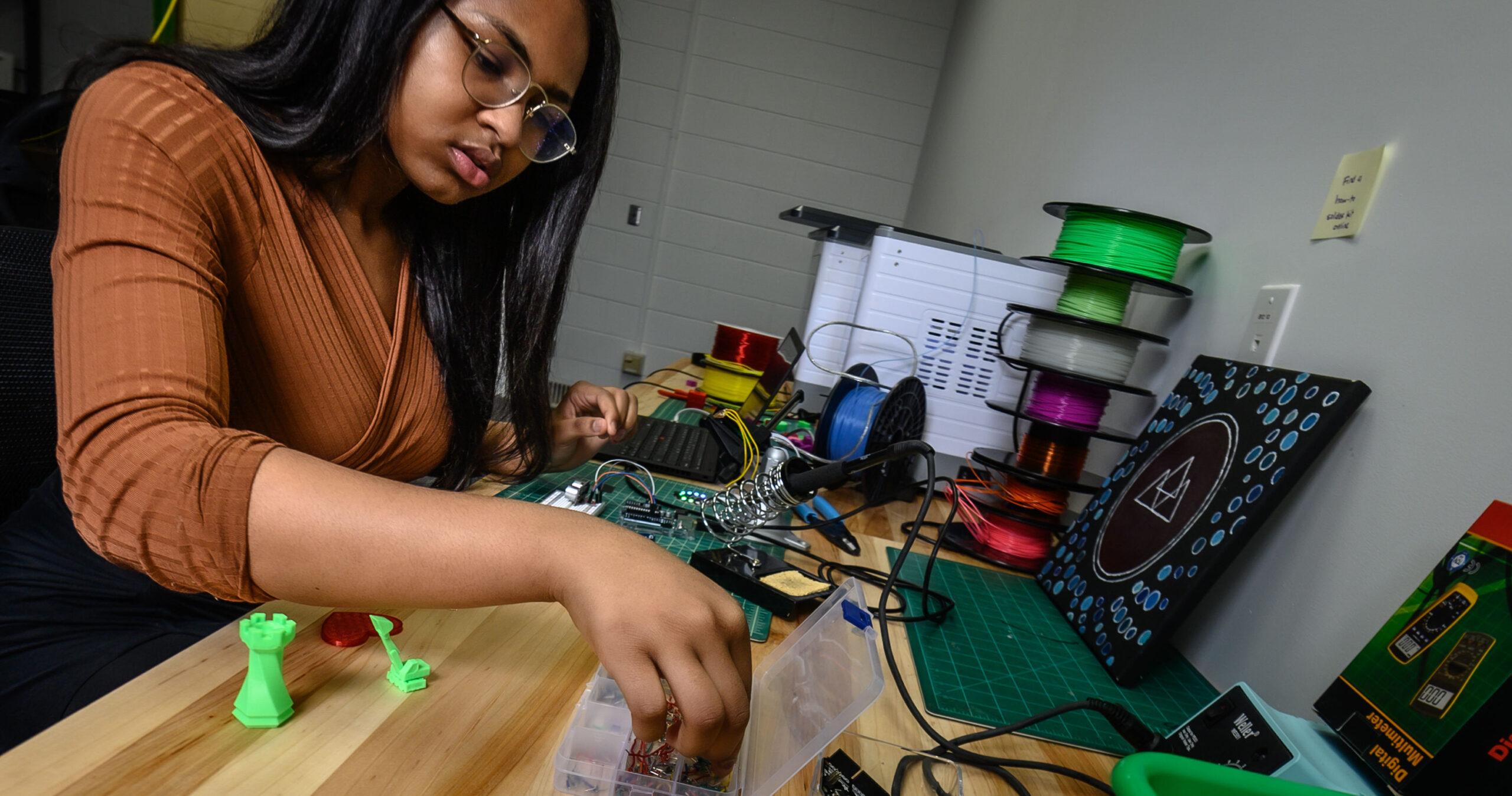 A Berea College student works in the classroom.